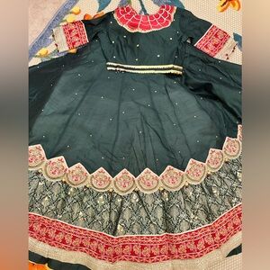 Ornate Green and Red Wedding Dress with Intricate Embellishments